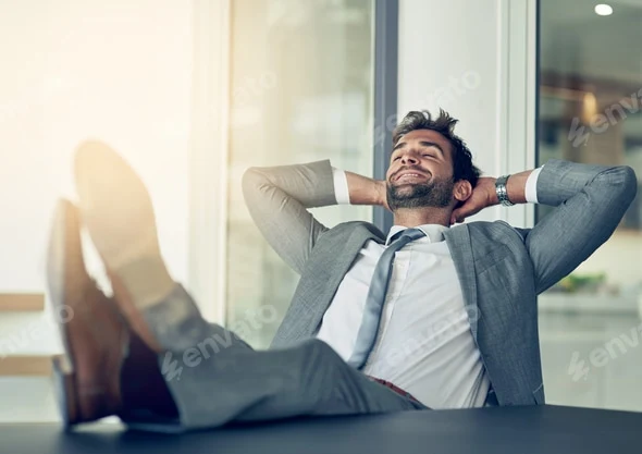 Relaxed adviser leaning back at his desk